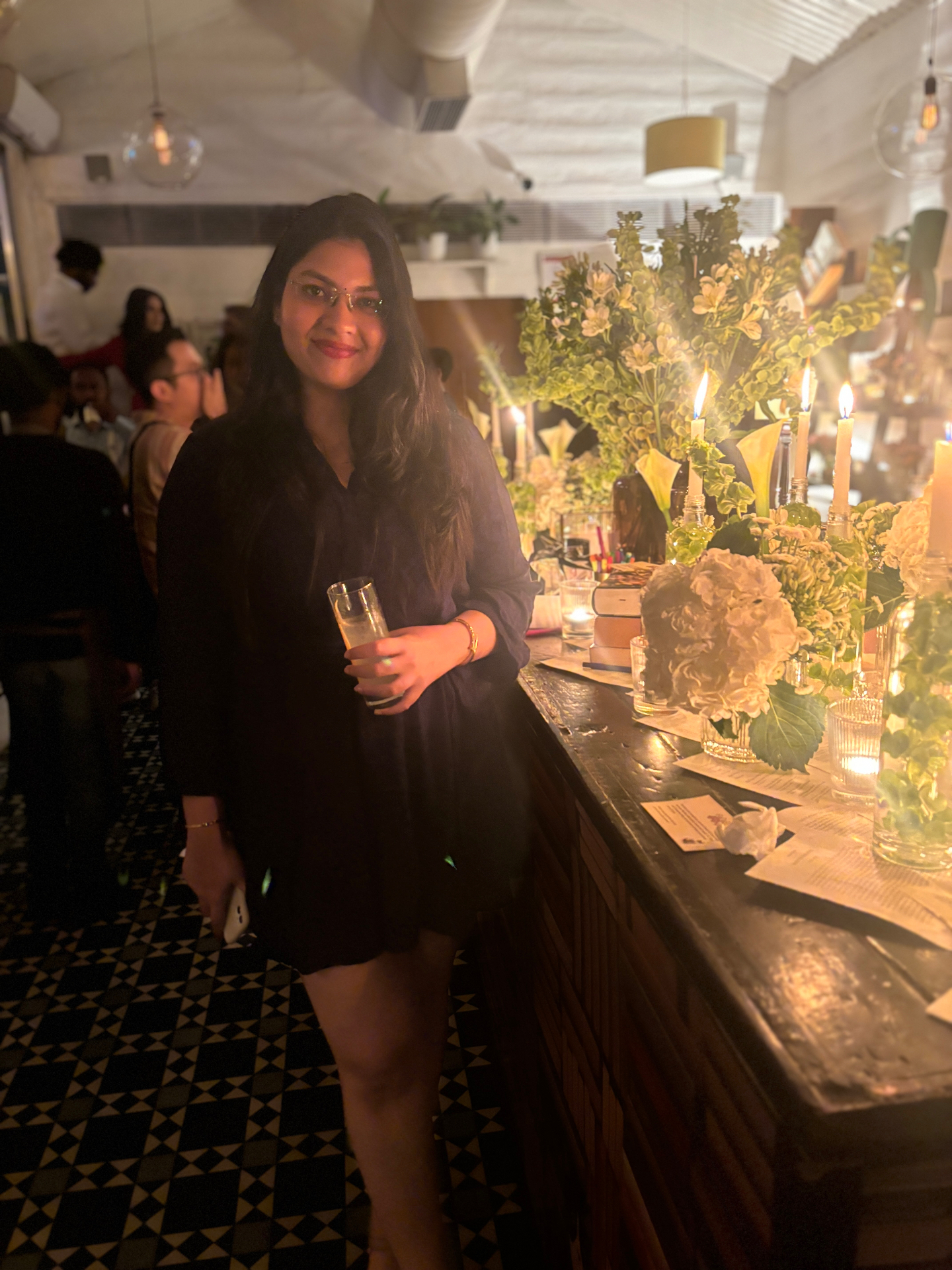 Candlelit launch event with floral styling